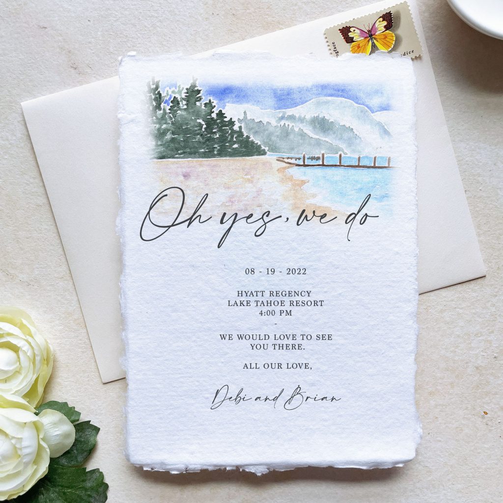 handmade paper wedding invitation that says "oh yes, we do" on an off0white background